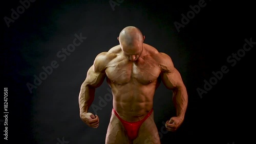 bodybuilder posing in studio