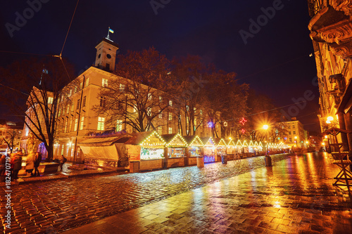 Photography Evening street with benches and lanterns.