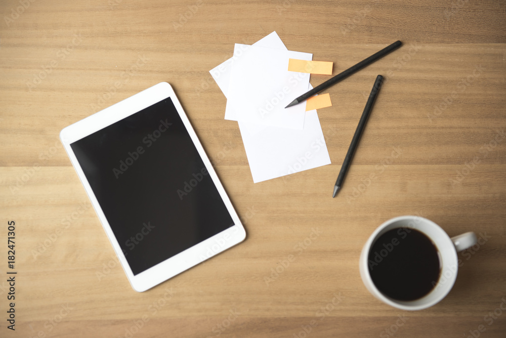 Background image of a tablet device with note paper and coffee Background image of a tablet device with note paper and coffee