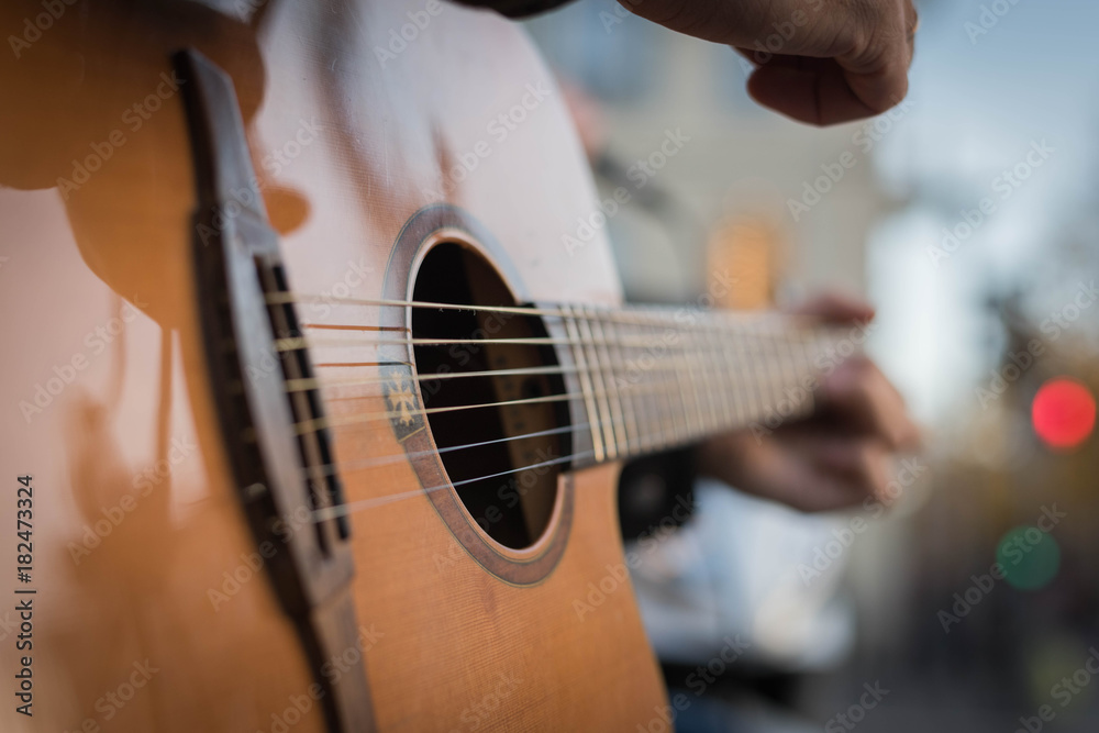 Fototapeta premium playing a guitar close-up