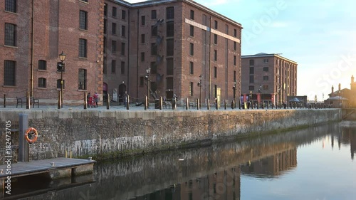 4k Albert docks in Liverpool, with reflection of victorian buildings in water photo