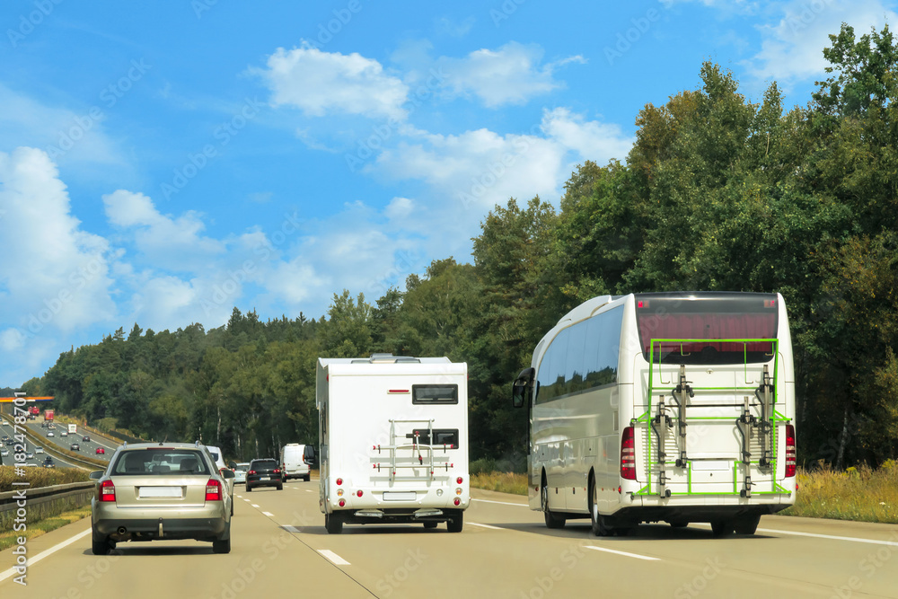 Caravan and bus on road in Switzerland