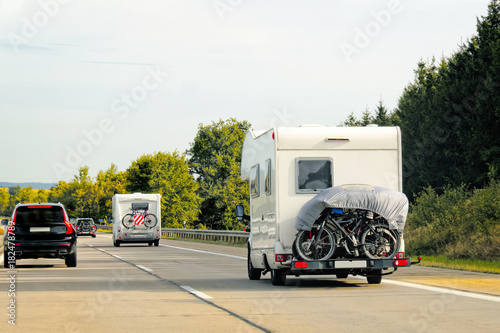 Caravans with bicycles on road at Switzerland