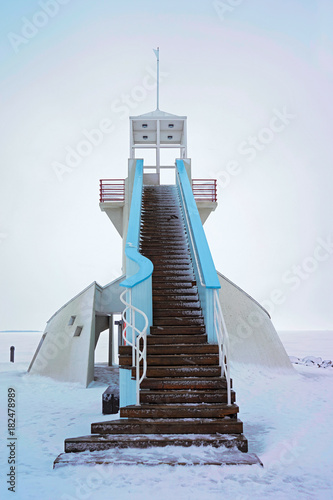 Lighthouse with stairs at Baltic Sea in winter Oulu photo