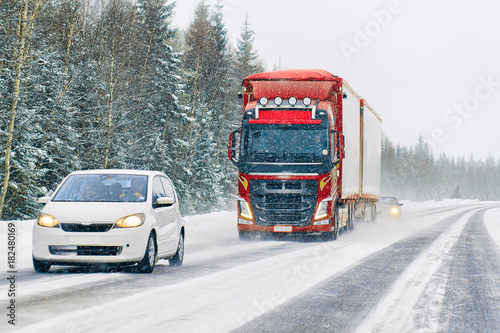 Car and Lorry in road in winter Rovaniemi