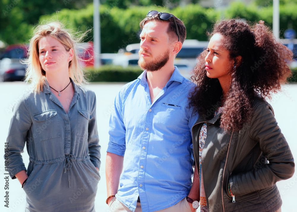 Young multiracial friends when looking serious Young multiracial friends when looking serious