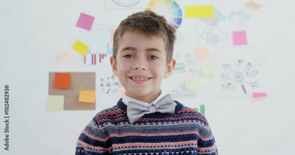 Smiling boy in office Smiling boy in office