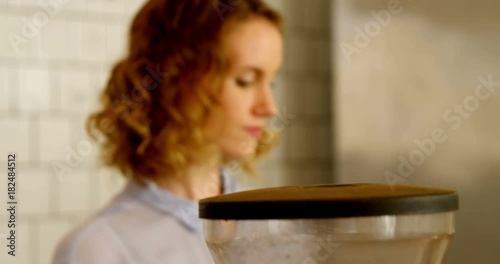 Female barista preparing coffee  photo