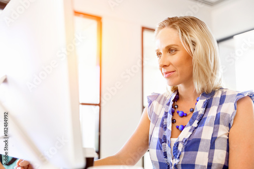 Portrait of businesswoman working at computer in office