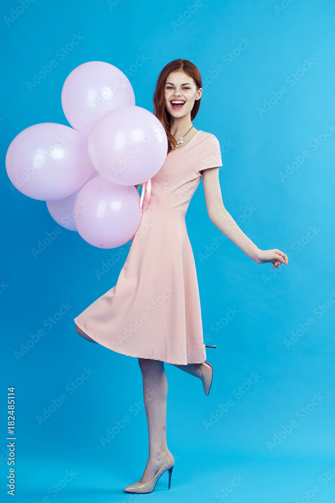 Beautiful woman holding pink balloons, fun Beautiful woman holding pink balloons, fun