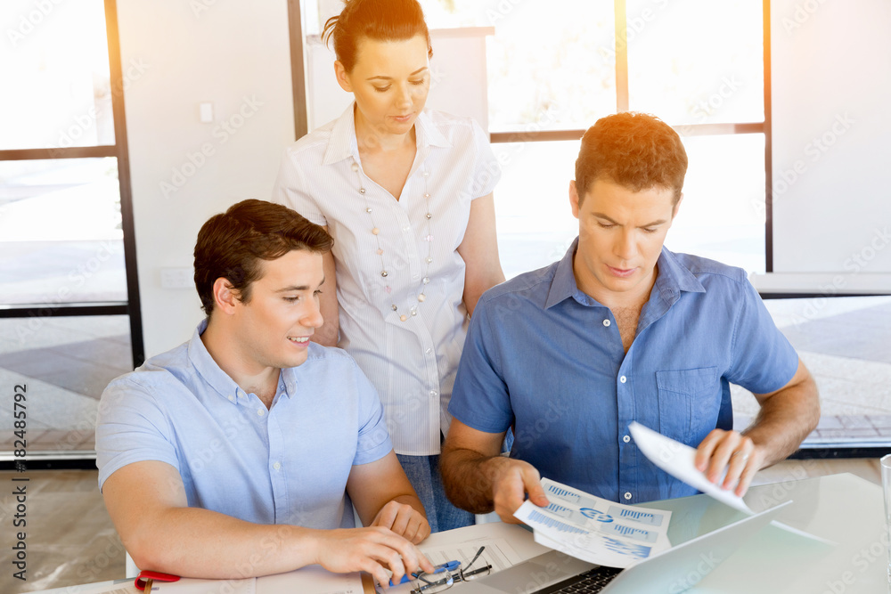 Fototapeta premium Group of happy young business people in a meeting
