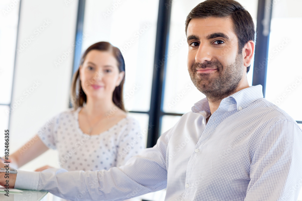 Image of two young business people in office Image of two young business people in office