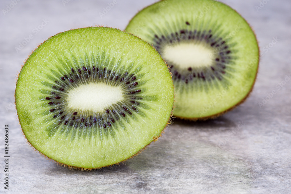 Half of juicy kiwi fruit on background. Half of juicy kiwi fruit on background.