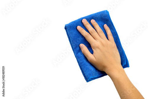 Hand and blue rag cleaning wall