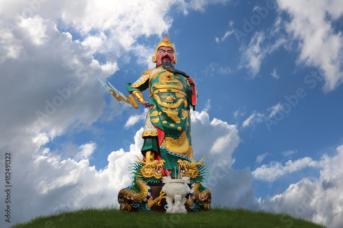 Statue of Guan Yu against the blue sky