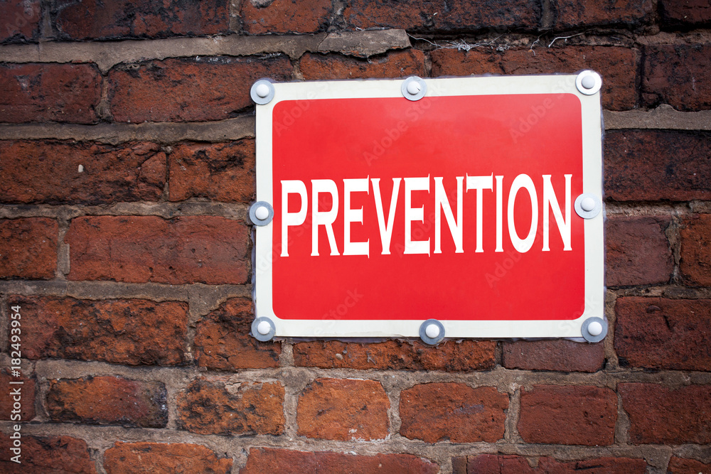 Obraz premium Hand writing text caption inspiration showing Prevention concept meaning Business Medical health illness disease written on old announcement road sign with background and copy space