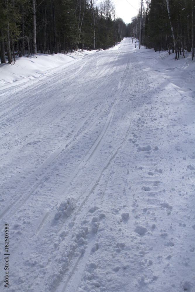 Snowmobile trail in winter on Bald Mountain in Rangeley, Maine.