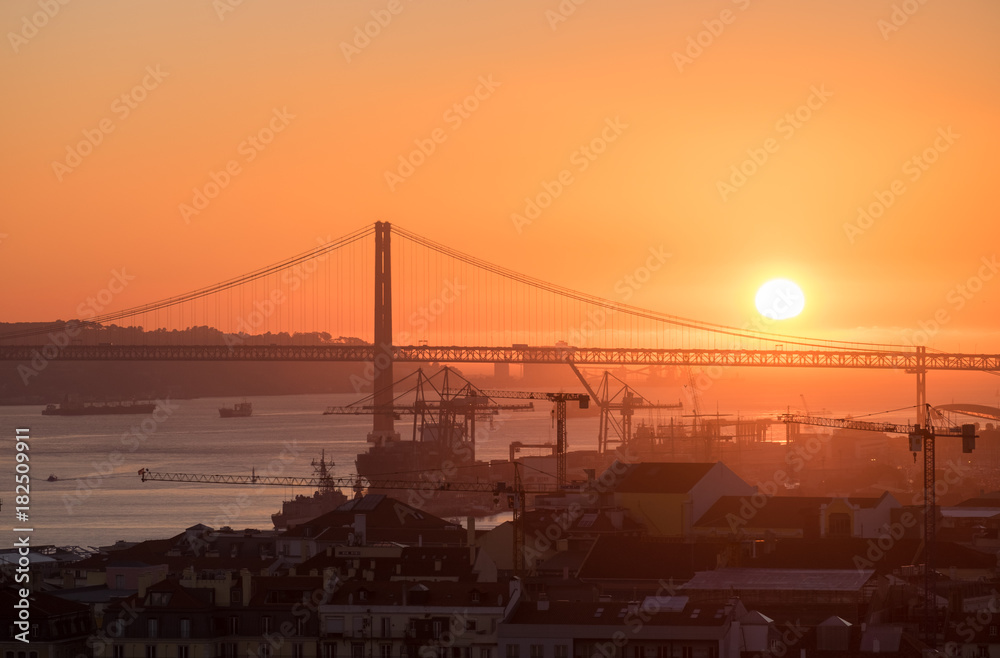 Amazing sunset on Ponte 25 de Abril Bridge, (25th of April Bridge) at Lisbon. Portugal