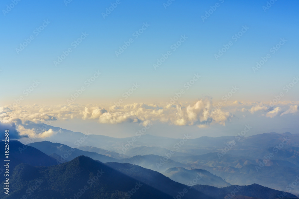 Beautiful scenery on the top of mountains at Kew Mae Pan Nature Trail in Doi Inthanon National park , viewing white clouds , blue sky and fog in the morning, Chiang Mai , Thailand