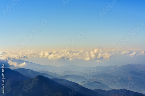 Beautiful scenery on the top of mountains at Kew Mae Pan Nature Trail in Doi Inthanon National park , viewing white clouds , blue sky and fog in the morning, Chiang Mai , Thailand © PK4289