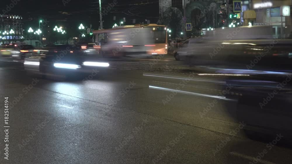 Cityscape car time lapse at night traffic through downtown. 4K UHD.