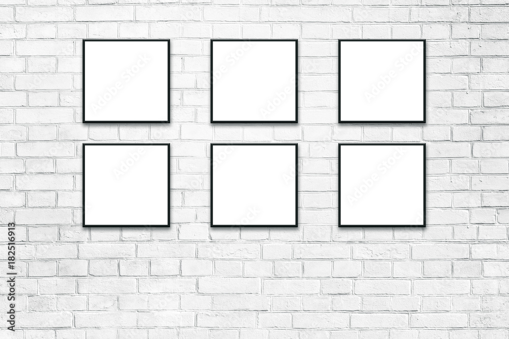 Blank white paper poster in black frame at white paint brick wall. Grungy interior, poster mock up. Presentation for artwork. Blank white paper poster in black frame at white paint brick wall. Grungy interior, poster mock up. Presentation for artwork.
