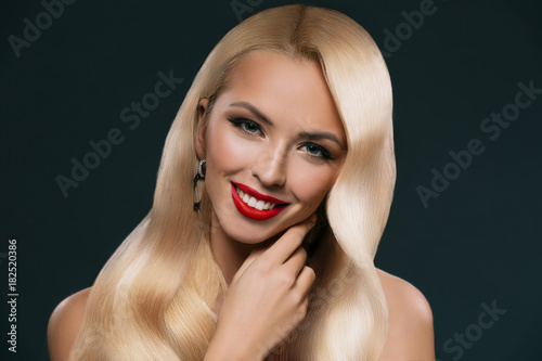 portrait of beautiful blonde hair girl with makeup isolated on black