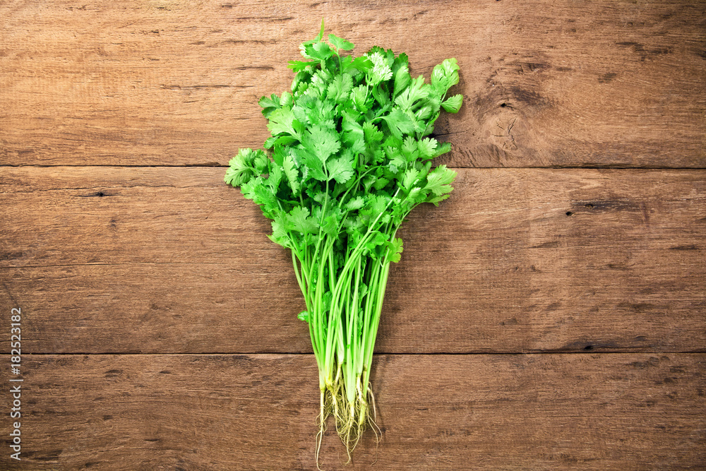 Fresh parsley on wood background Fresh parsley on wood background