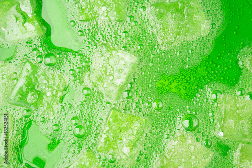 Green soda water juice cold drink fruit with ice and bubble for background design hi resolution detail texture surface