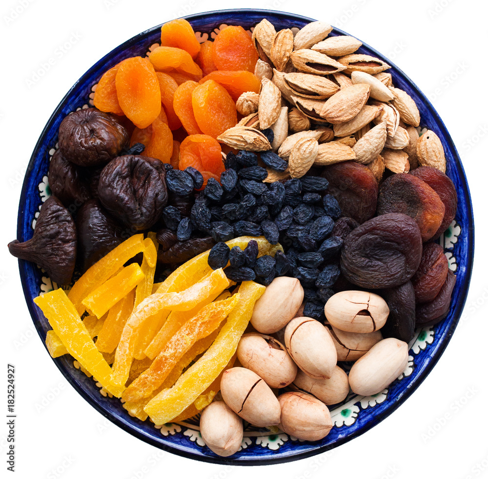 Top view of Central Asian dried fruits and nuts in a typical blue ...
