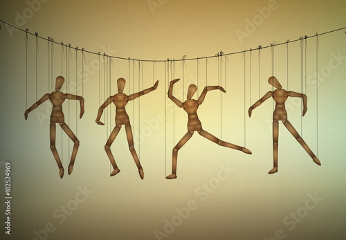 many marionette in different positions hanging on the threats, manipulate the people concept,