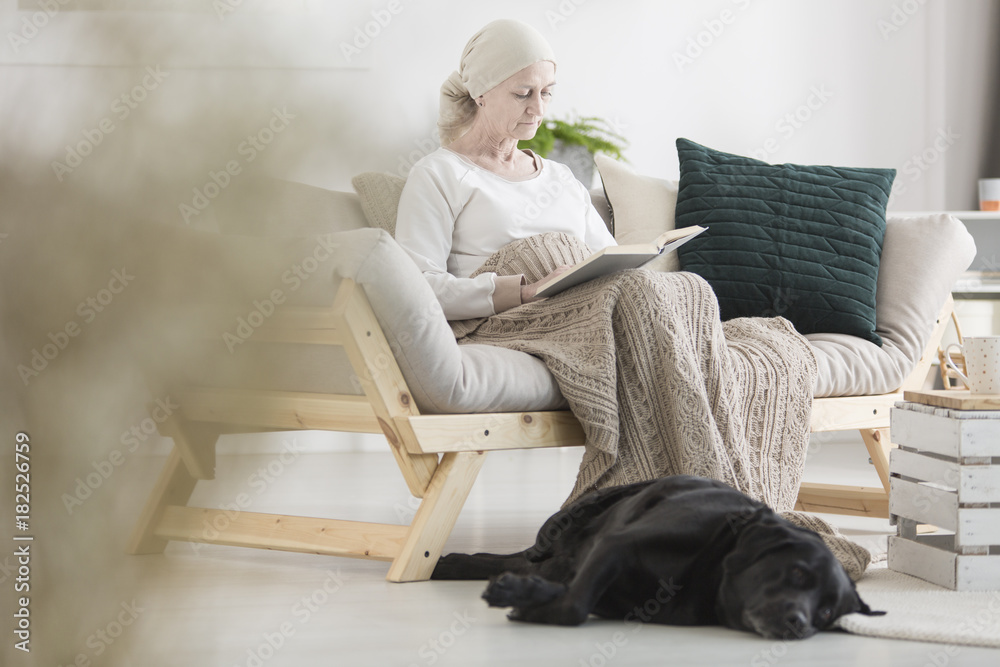 Sick woman reading book Sick woman reading book