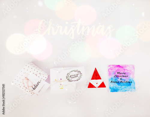 Christmas decoration with square gift box and greeting card for celebration with snow falling and colorful bokeh best Christmas holidays background image for Holiday invitation and banner