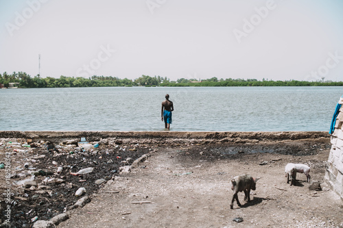 Man walking to water photo