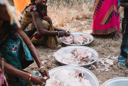 Women plucking birds