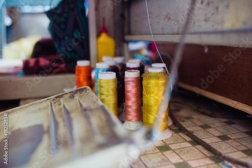 Colorful theads on table photo