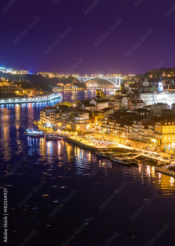 Colorful downtown river city with bridges at night background, Porto Portugal