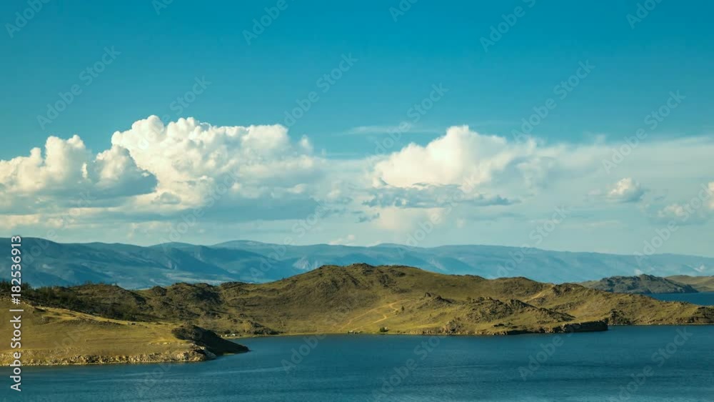 Timelapse. A white clouds moving over the shore of Lake Baikal Timelapse. A white clouds moving over the shore of Lake Baikal