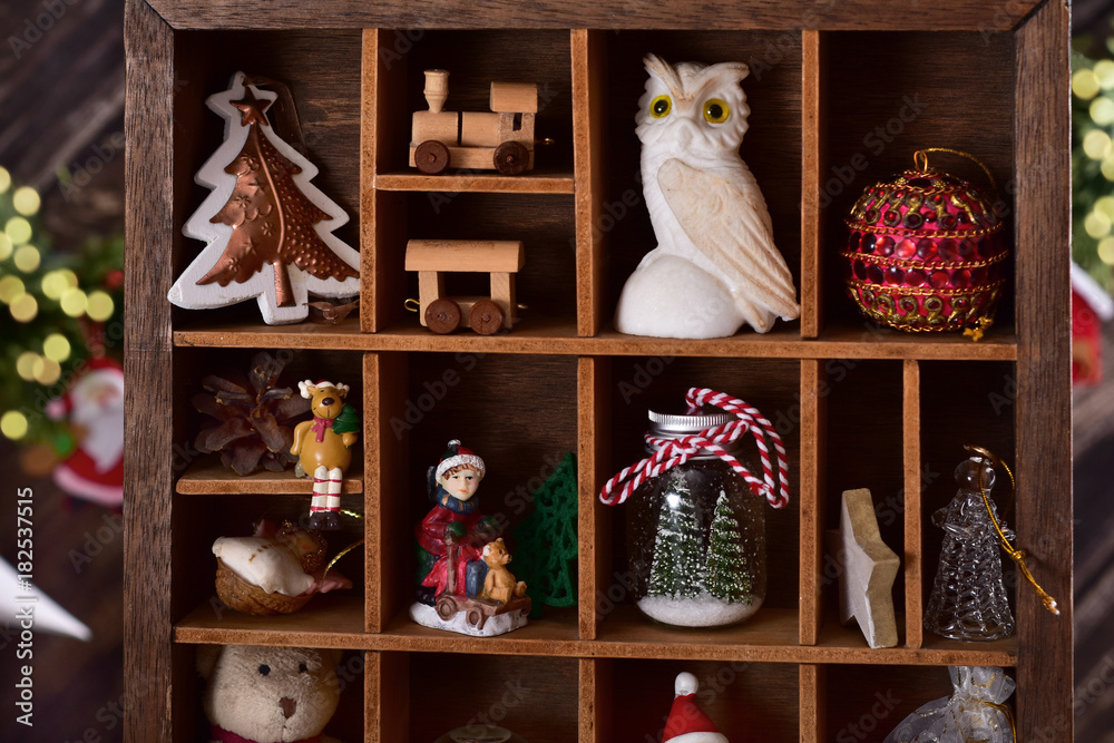 wooden shadow box with christmas decor and toy collection
