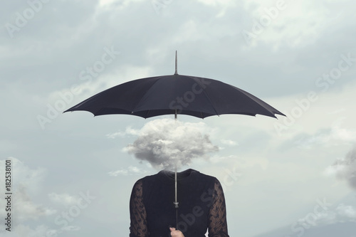 Φωτογραφία elegant woman with cloud head sheltering herself from the rain with umbrella
