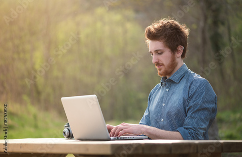 Young man working outdoors