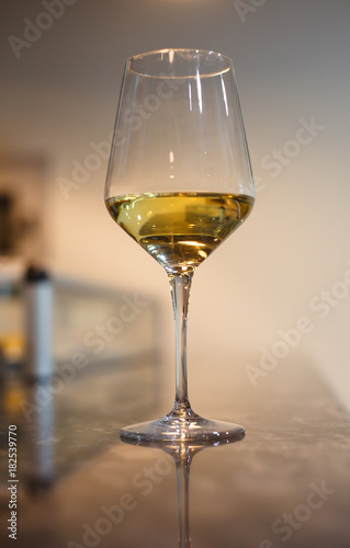 Glass of white wine on bar