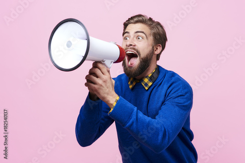 Man yelling into a megaphone .. photo