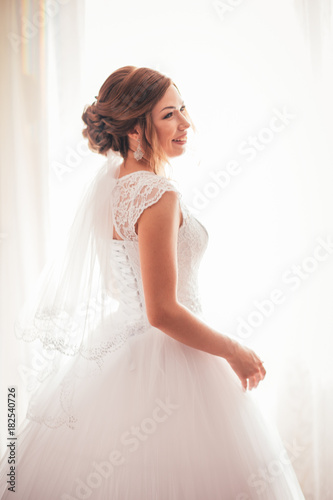 portrait of a young bride on a light background