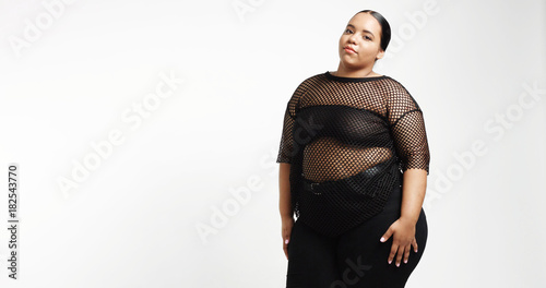 Plus size model in studio shoot happy smiling photo