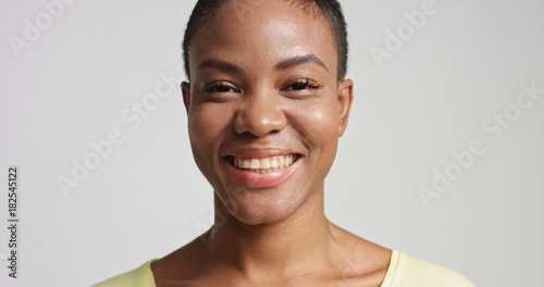pretty mixed race woman with short hair laughing
