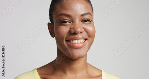 pretty mixed race woman with short hair laughing
