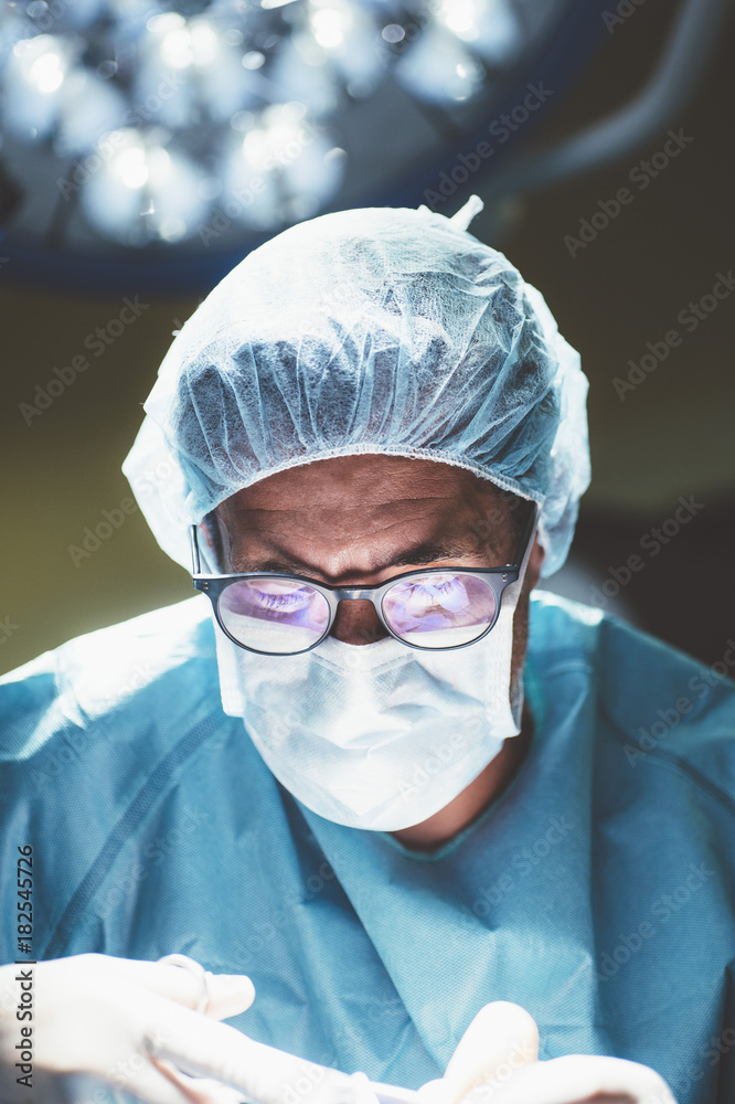 Concentrated surgeon in process of work Concentrated surgeon in process of work
