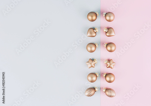Christmas tree balls on a gray and pink background.