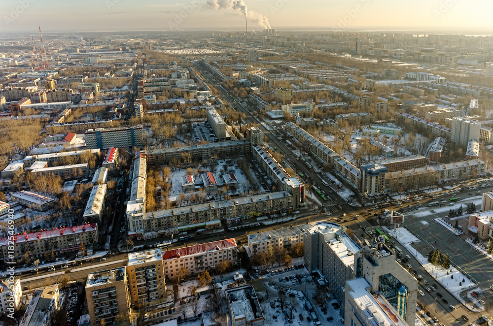 Tyumen, Russia - November 10, 2015: Aerial view on residential districts with TV towers and city power factory at background